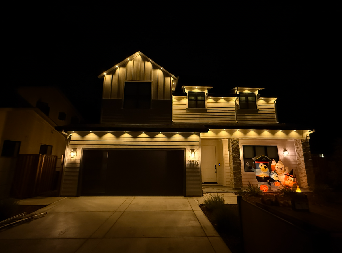 Modern farmhouse with new Govee Prism system displaying warm white downlighting